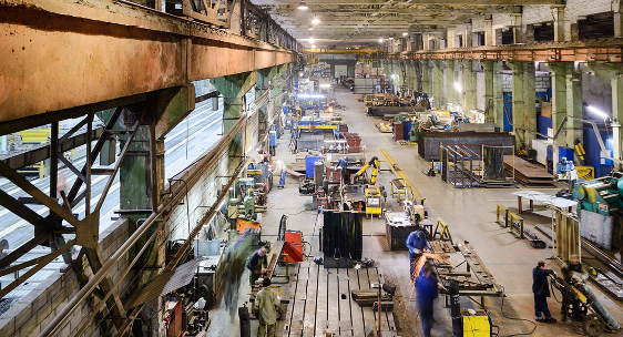 People working inside a factory