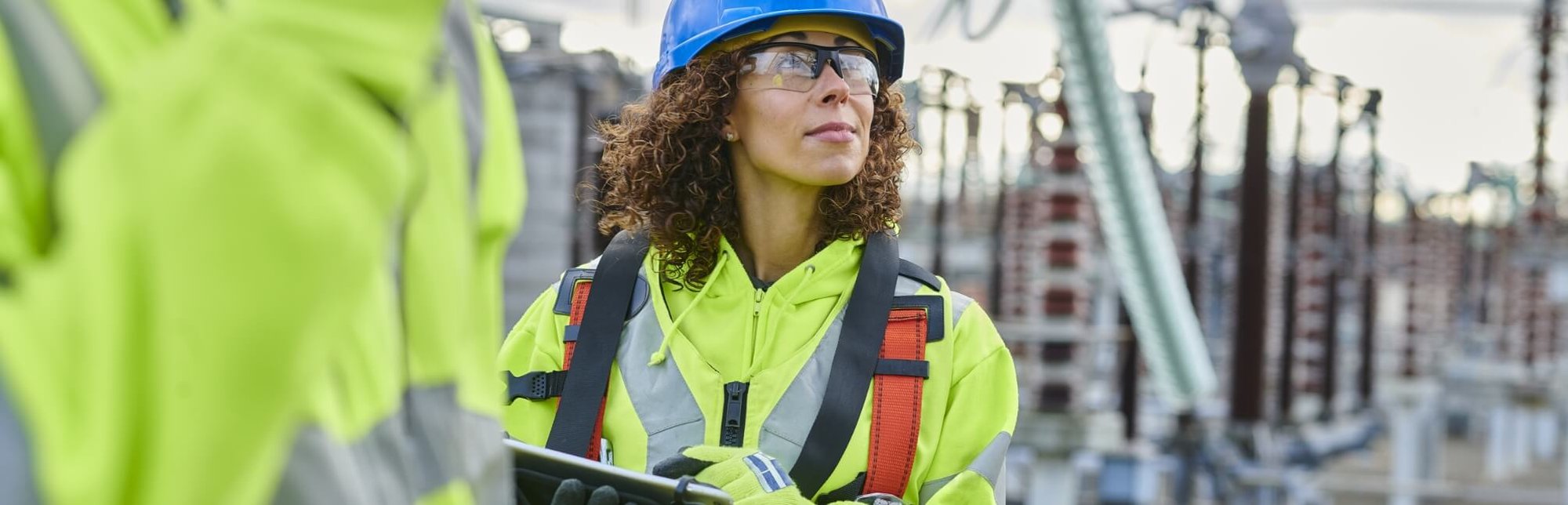 Woman looking up at a construction site