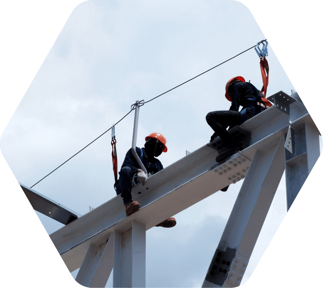 Construction workers on a metal beam