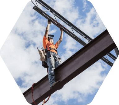 Man on beam at a construction project