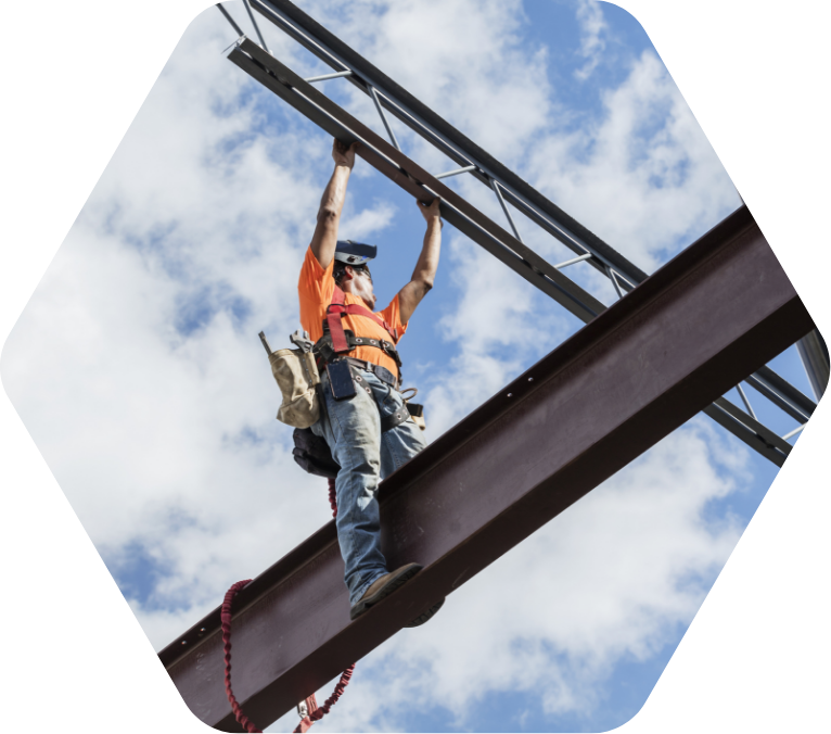 Man on beam at a construction project