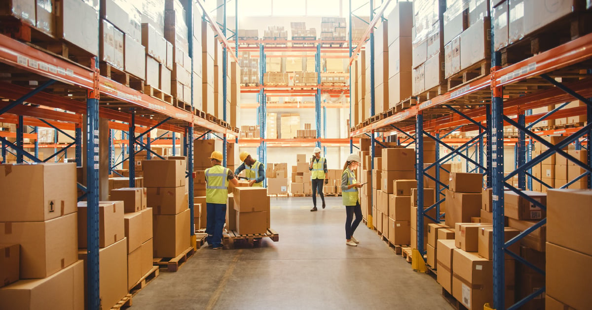 People moving packages around at a distribution center