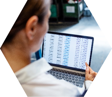 Man review SKUs on a laptop